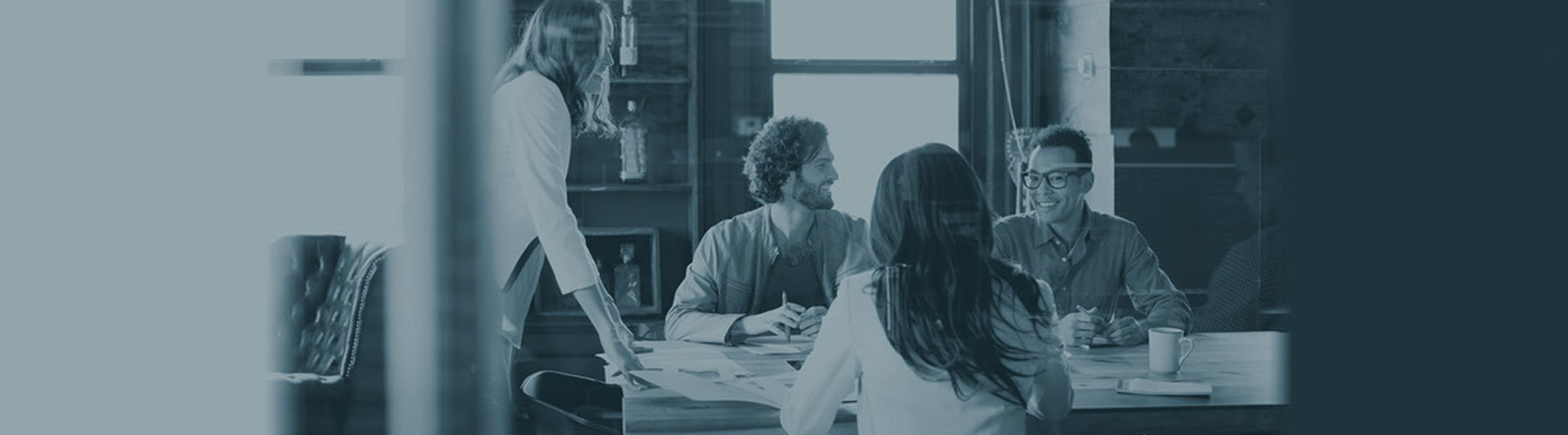 A group of people at a conference table